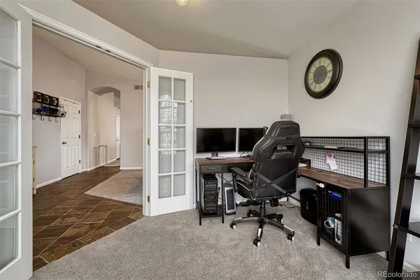 a view of a workspace with furniture