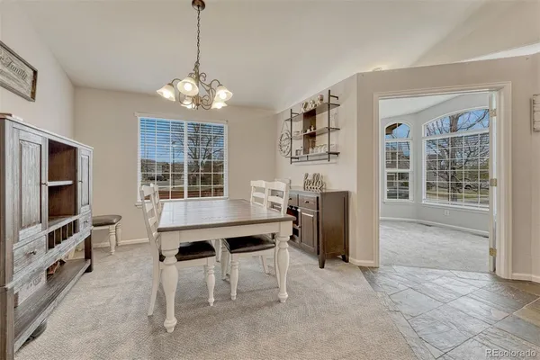 a view of a livingroom with furniture window and wooden floor