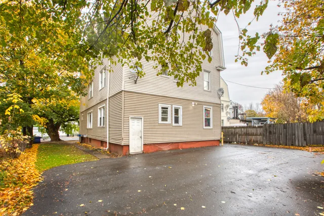 a view of a house with a backyard