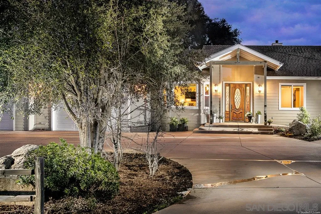 4047 Ritchie Road Santa Ysabel, CA 92070 - Photo 1 of 25 a front view of a house with a yard and garage