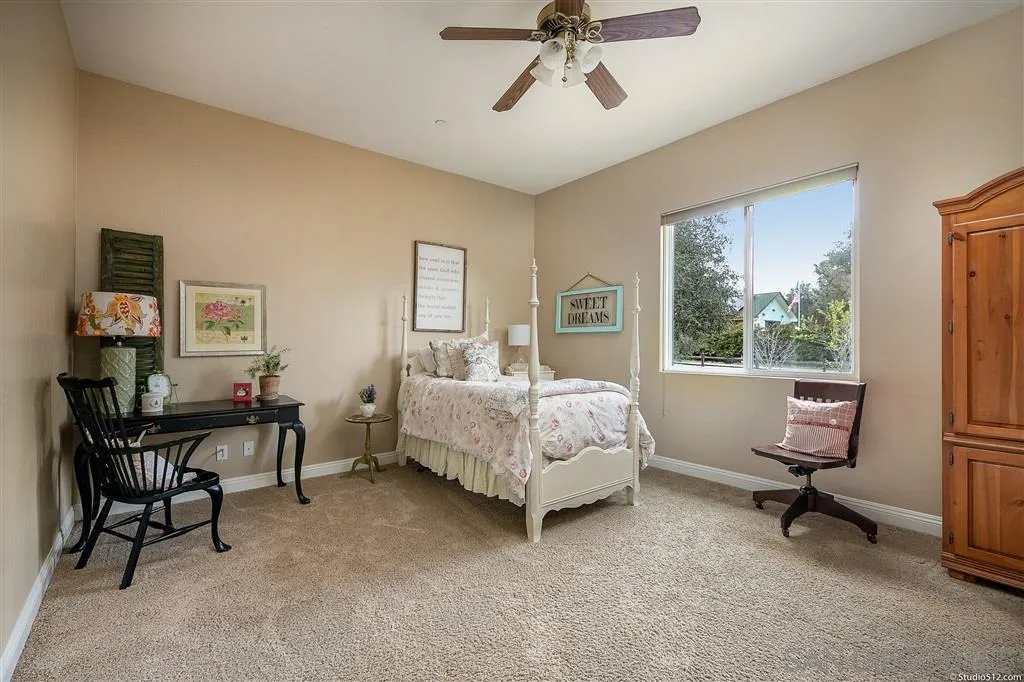 4047 Ritchie Road Santa Ysabel, CA 92070 - Photo 18 of 25 a bed room with a bed and a chair