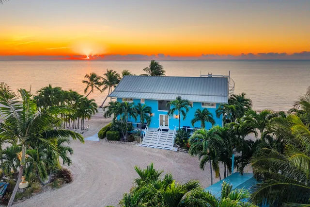 a view of a hallway with a white furniture and floor to ceiling window