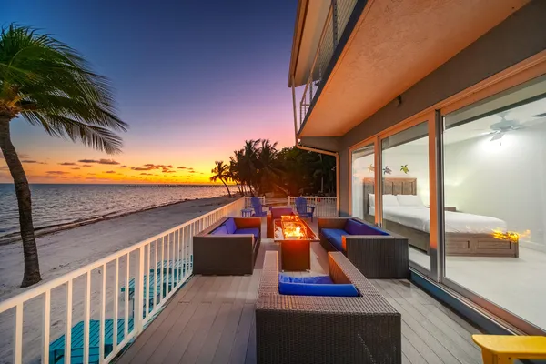 a bathroom with a sink mirror and toilet