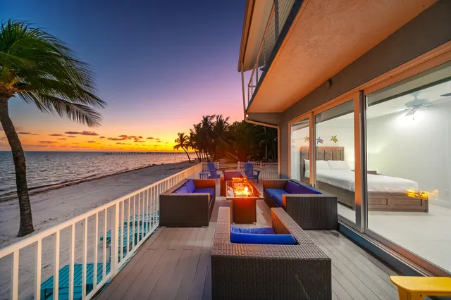 a bathroom with a sink mirror and toilet