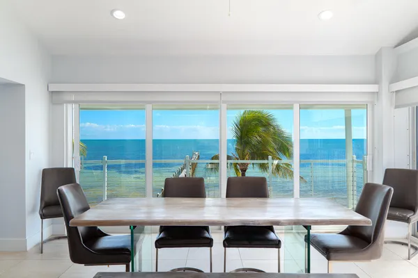 a kitchen with stainless steel appliances white cabinets and a refrigerator