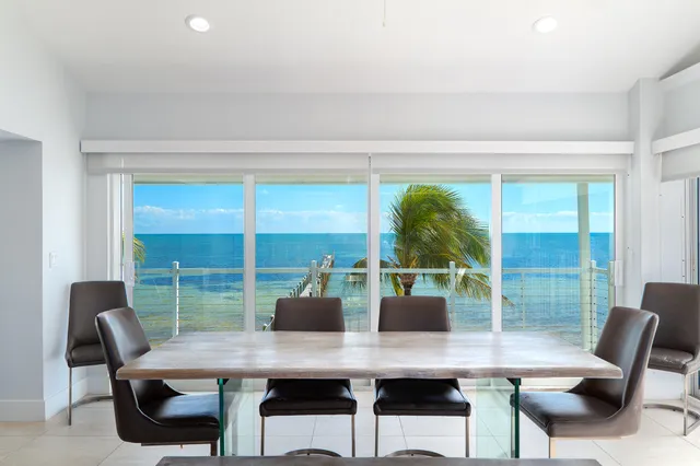 a kitchen with stainless steel appliances white cabinets and a refrigerator