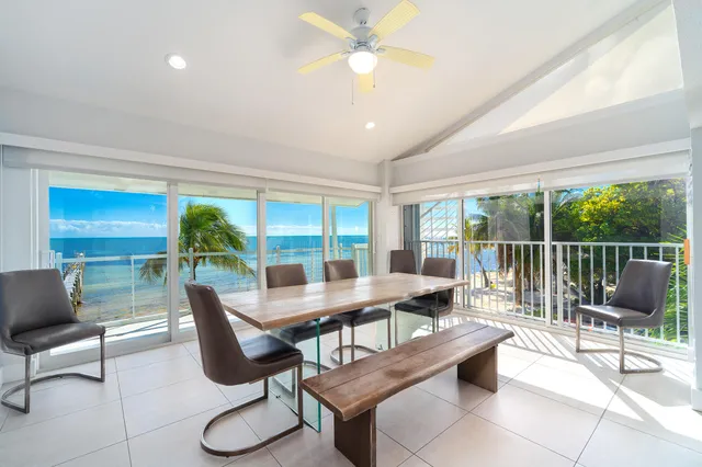 a large kitchen with stainless steel appliances granite countertop a refrigerator and a stove top oven