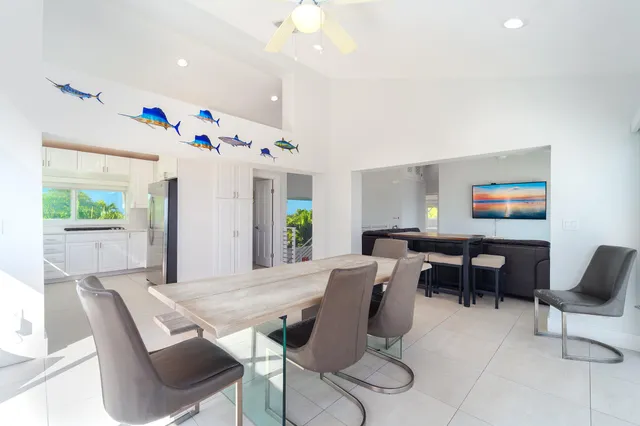 a kitchen with stainless steel appliances kitchen island granite countertop a stove a sink and a microwave