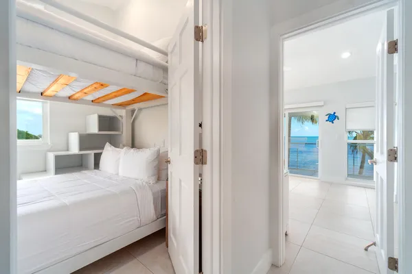 a view of staircase with white walls and a window