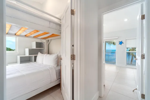 a view of staircase with white walls and a window