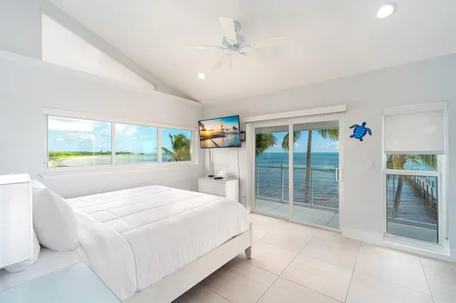 a spacious bathroom with a granite countertop sink a mirror and a