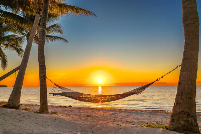 a view of balcony with wooden floor and outdoor seating