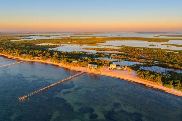 a view of a chairs and table in the balcony