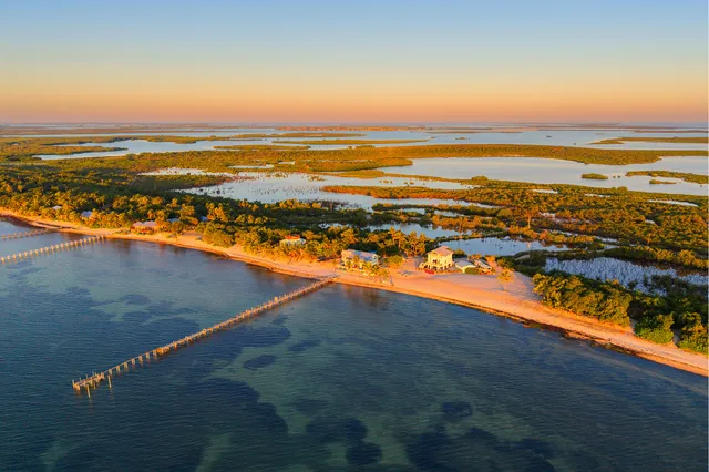 a view of a chairs and table in the balcony