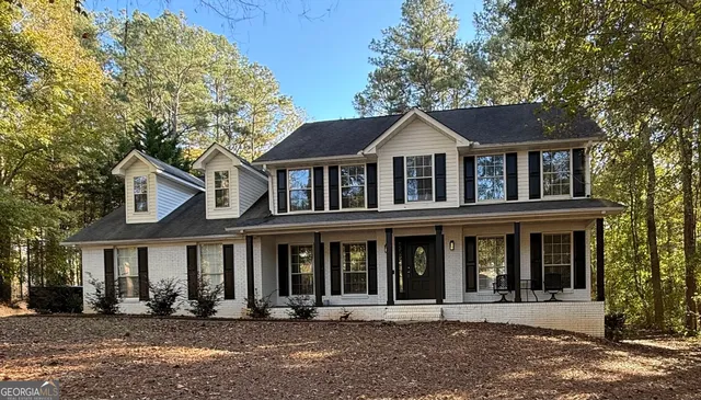 front view of a brick house with a outdoor space