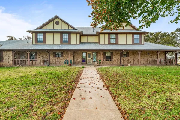 a front view of a house with yard