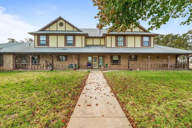 a front view of a house with yard