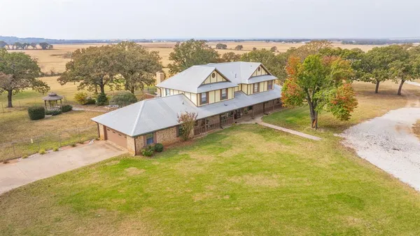 an aerial view of houses with yard