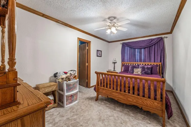 a view of a room with furniture and chandelier