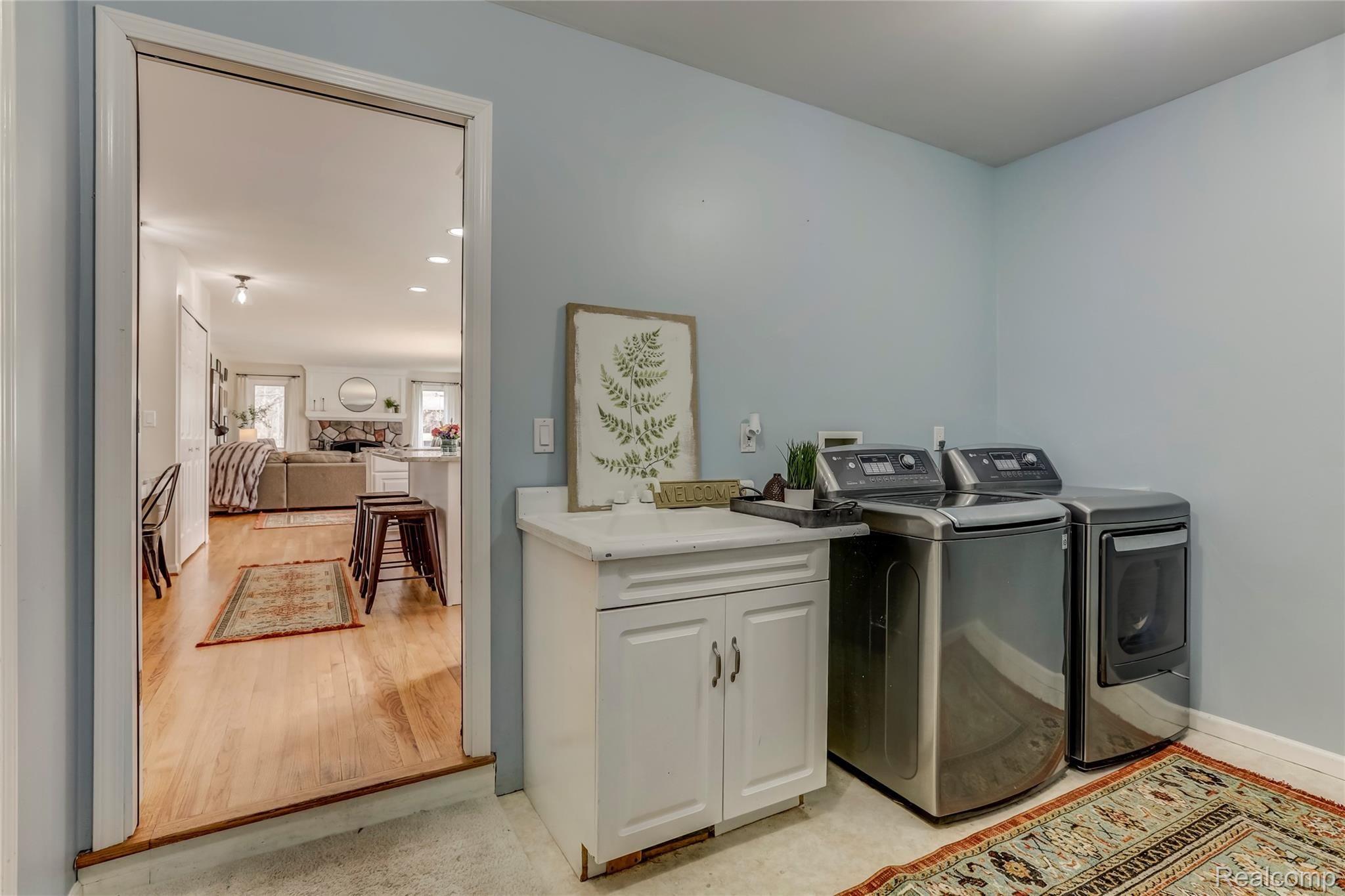2695 Chilson Road Howell, MI 48843 - Photo 20 of 50 First floor laundry room with wash tub