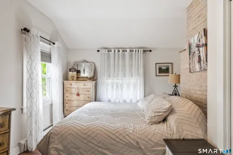 a bedroom with a bed and a cabinets