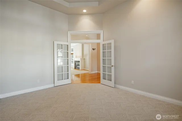 an empty room with an entrance and door