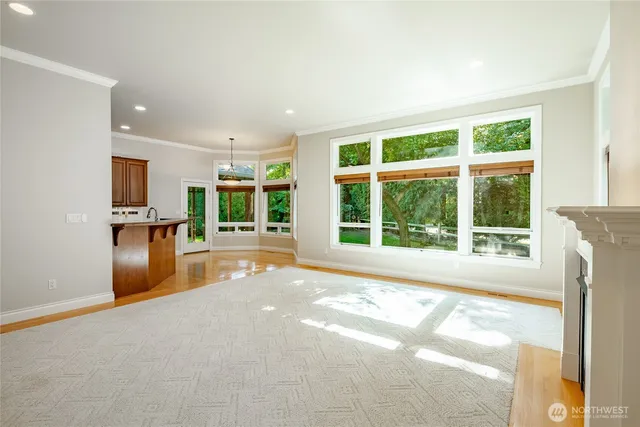 a view of a kitchen with a sink and a window