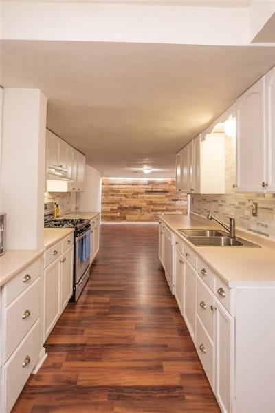 804 Jefferson Road Pittsburgh, PA 15235 - Photo 11 of 25 Long and efficient kitchen with an abundance of white cabinets and new backsplash!