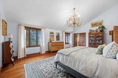 a living room with lots of furniture and a wooden floors