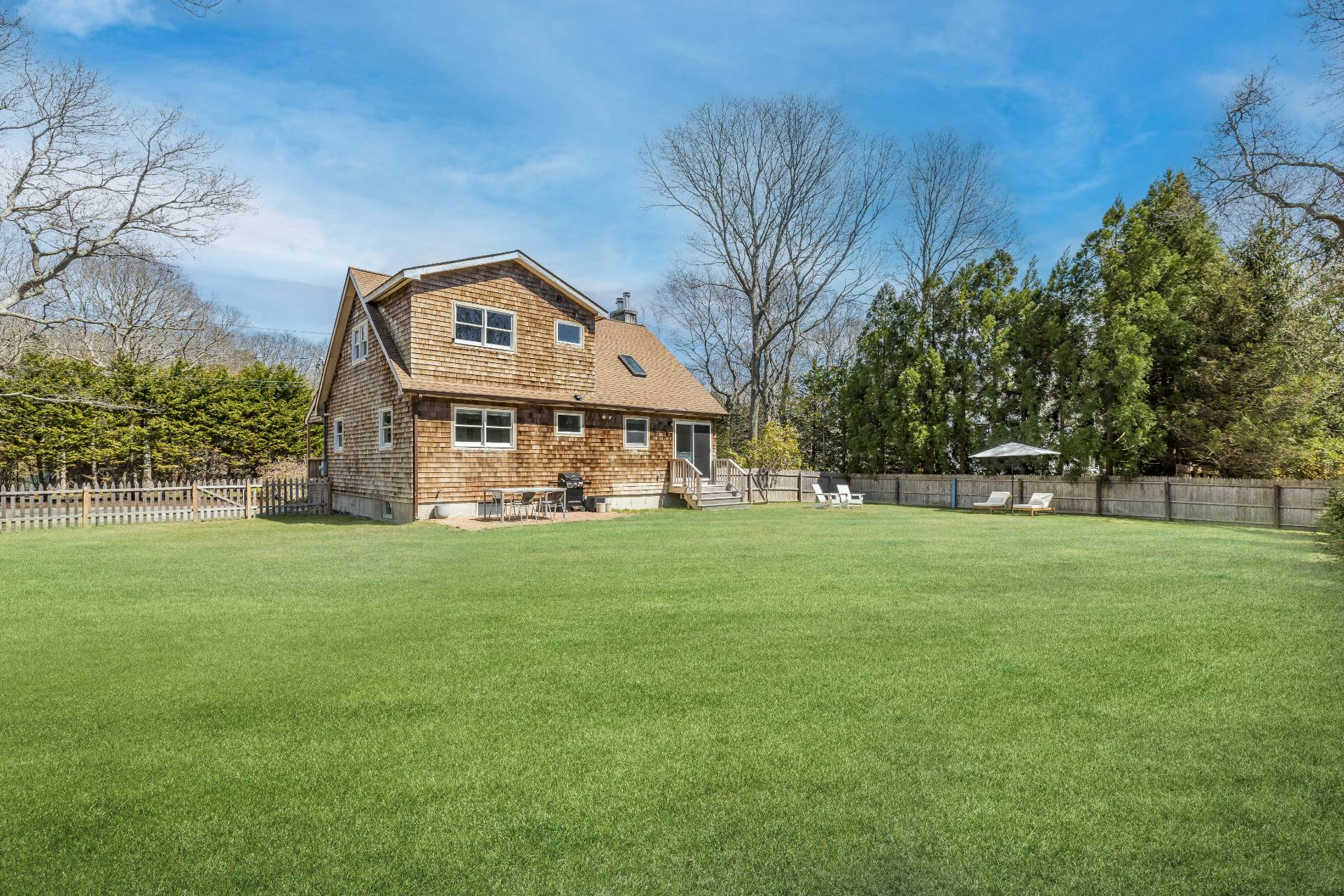 16 Central Avenue East Hampton, NY 11937 - Photo 13 of 16 a front view of a house with a yard