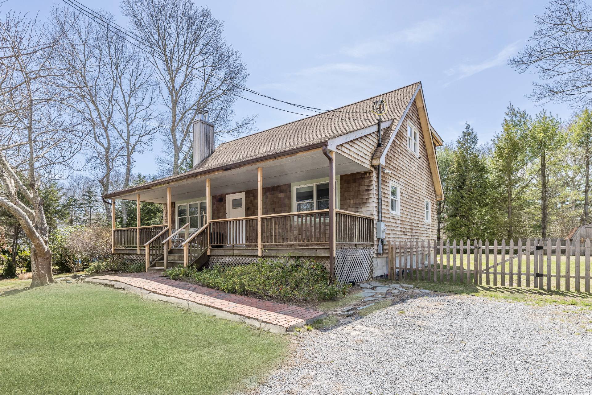 16 Central Avenue East Hampton, NY 11937 - Photo 14 of 16 a front view of a house with a yard