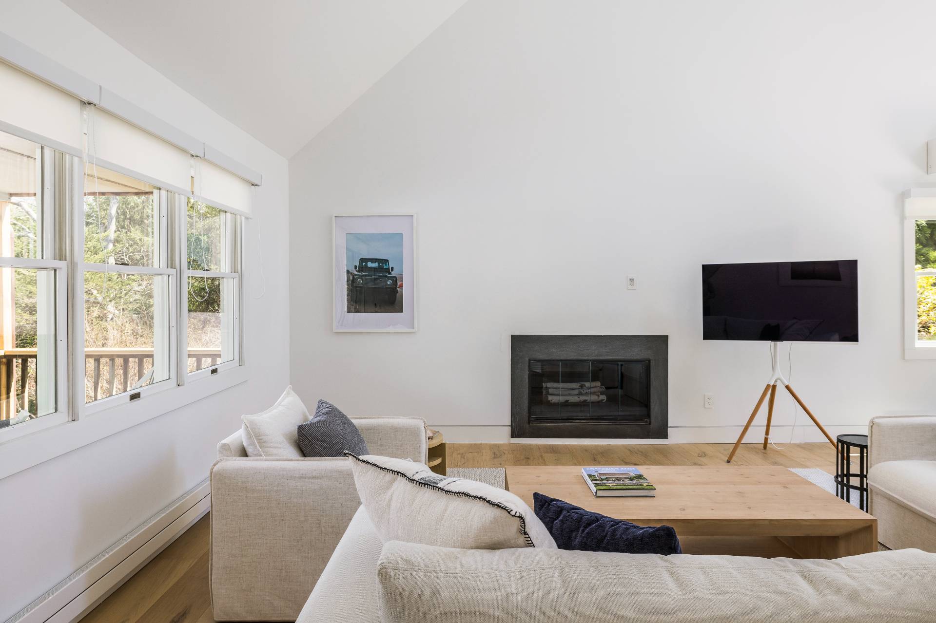 16 Central Avenue East Hampton, NY 11937 - Photo 5 of 16 a living room with furniture and a flat screen tv