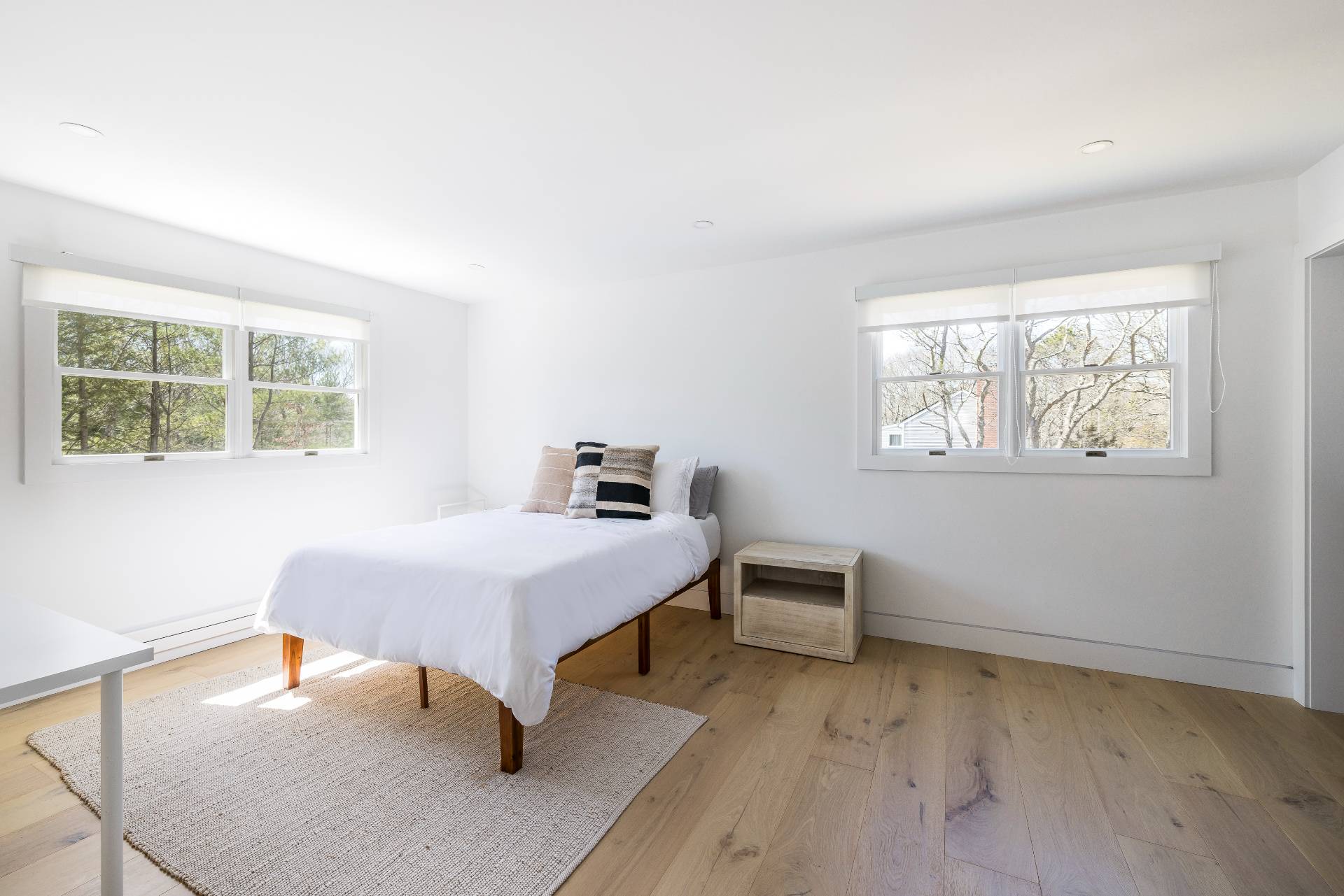 16 Central Avenue East Hampton, NY 11937 - Photo 9 of 16 a bedroom with a bed and a window