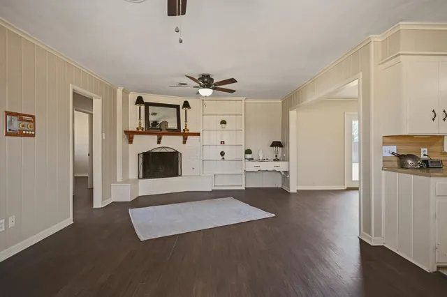 wooden floor fireplace and windows in a room
