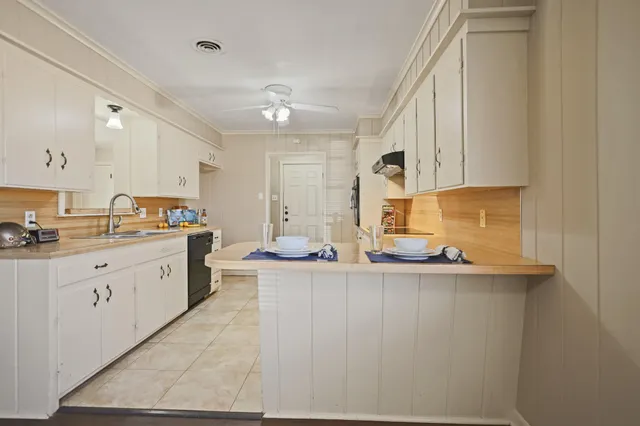 a kitchen with a sink and cabinets