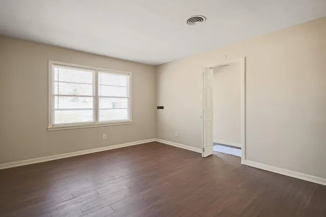a bathroom with a sink vanity mirror and toilet