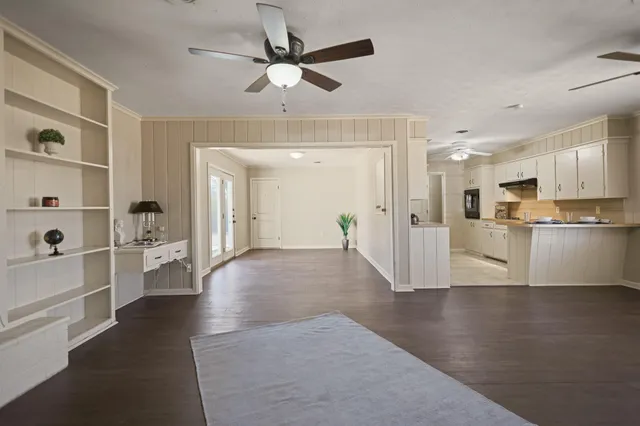 a view of a kitchen with a sink and a refrigerator