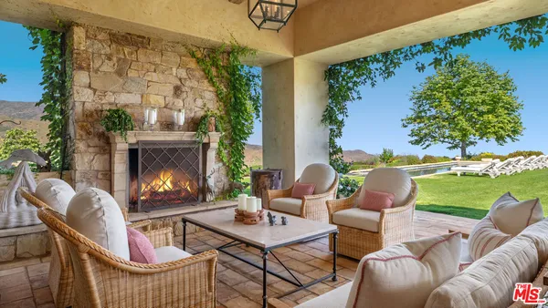 a view of a two chairs with an outdoor view