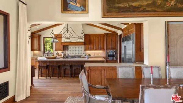 a kitchen with a table and chairs in it