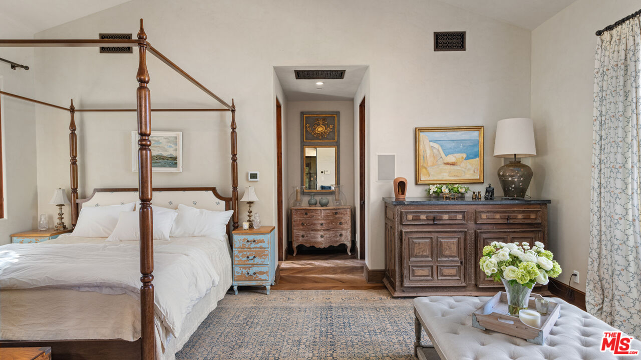 2900 Corral Canyon Road Malibu, CA 90265 - Photo 25 of 48 a bedroom with a bed and ceiling fan