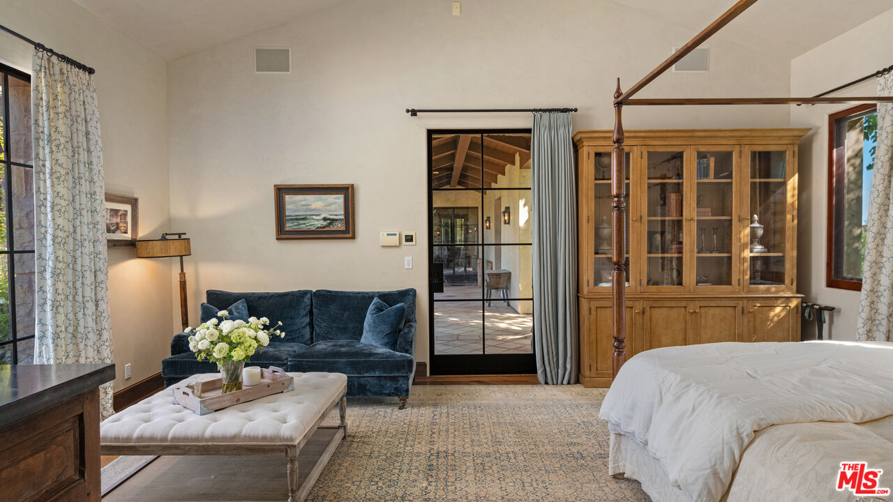 2900 Corral Canyon Road Malibu, CA 90265 - Photo 26 of 48 a bedroom with furniture and a large window