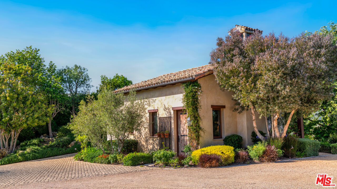 2900 Corral Canyon Road Malibu, CA 90265 - Photo 28 of 48 a front view of a house with garden