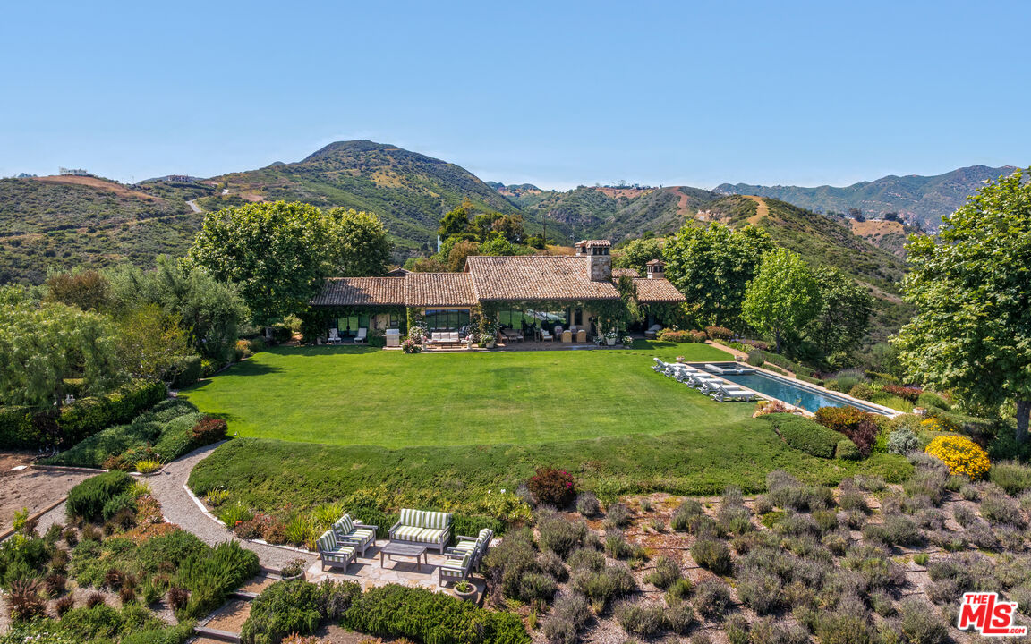 2900 Corral Canyon Road Malibu, CA 90265 - Photo 3 of 48 a view of a lush green hillside and houses