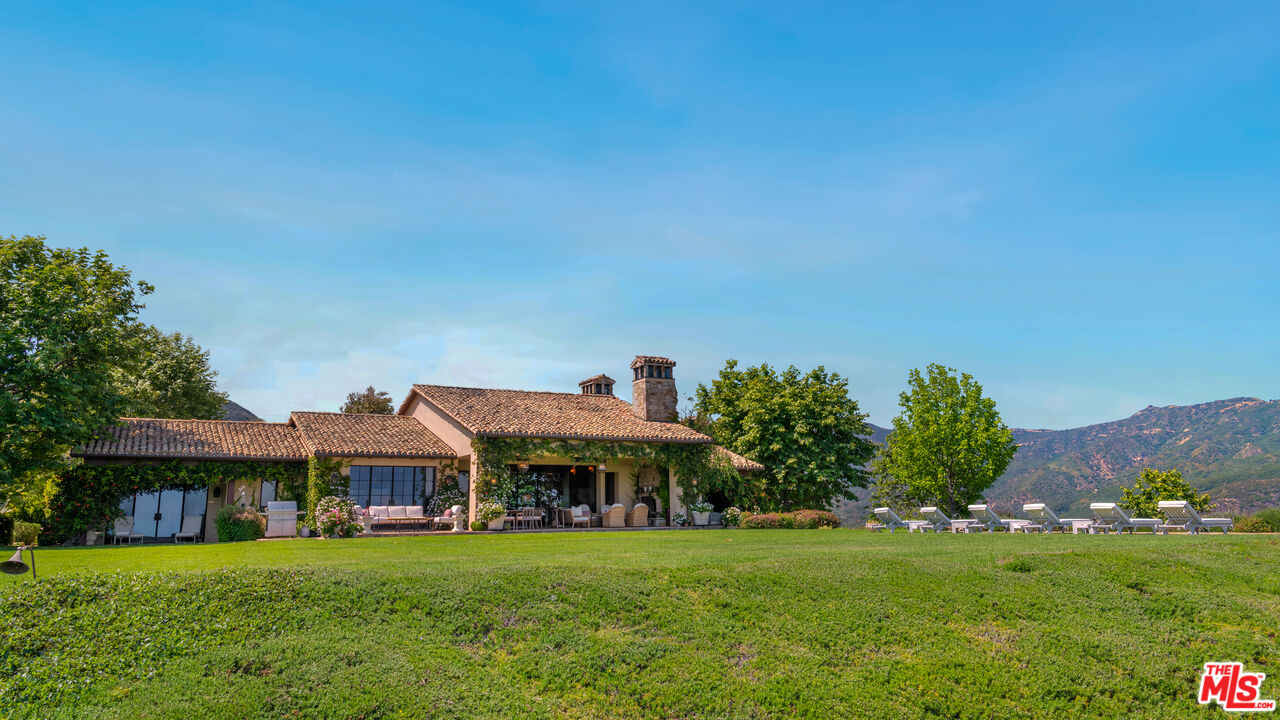 2900 Corral Canyon Road Malibu, CA 90265 - Photo 31 of 48 a front view of a house with a garden