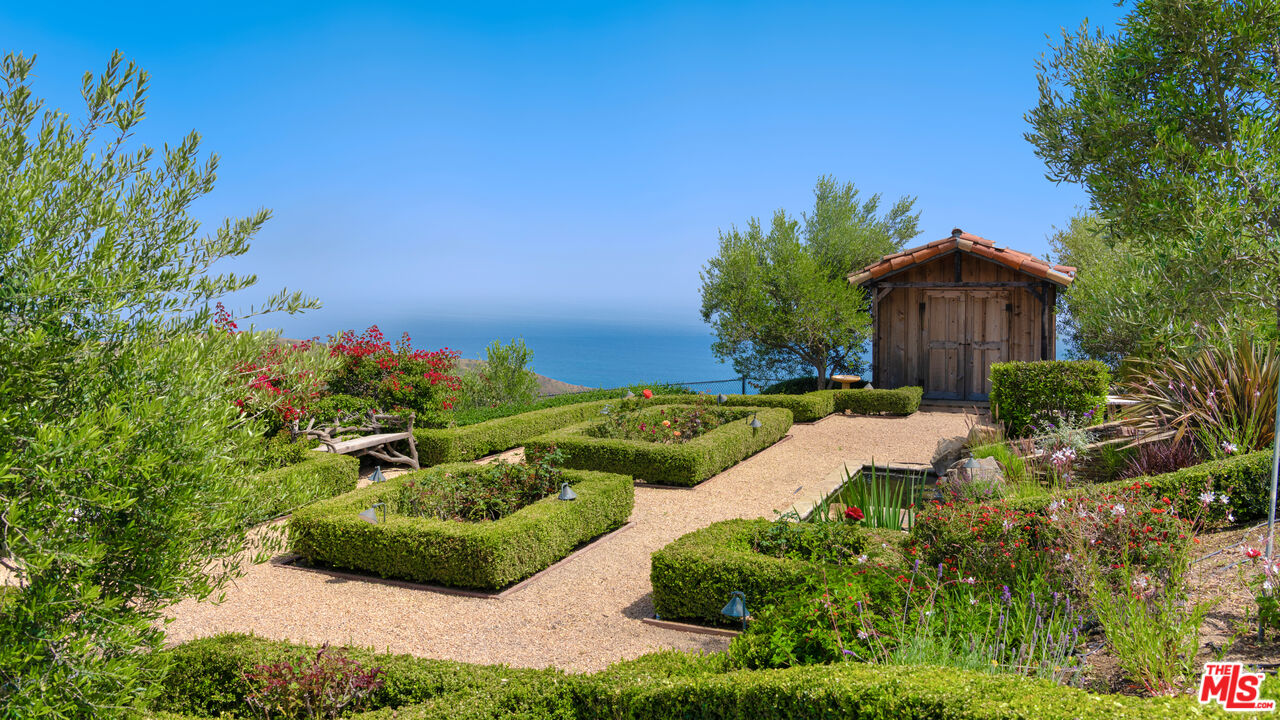 2900 Corral Canyon Road Malibu, CA 90265 - Photo 39 of 48 a view of a garden with a house