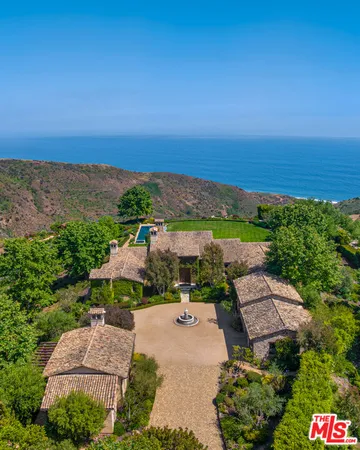 an aerial view of a house with a garden