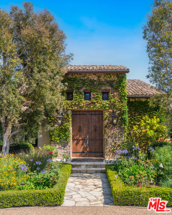 2900 Corral Canyon Road Malibu, CA 90265 - Photo 9 of 48 a front view of a house with a yard