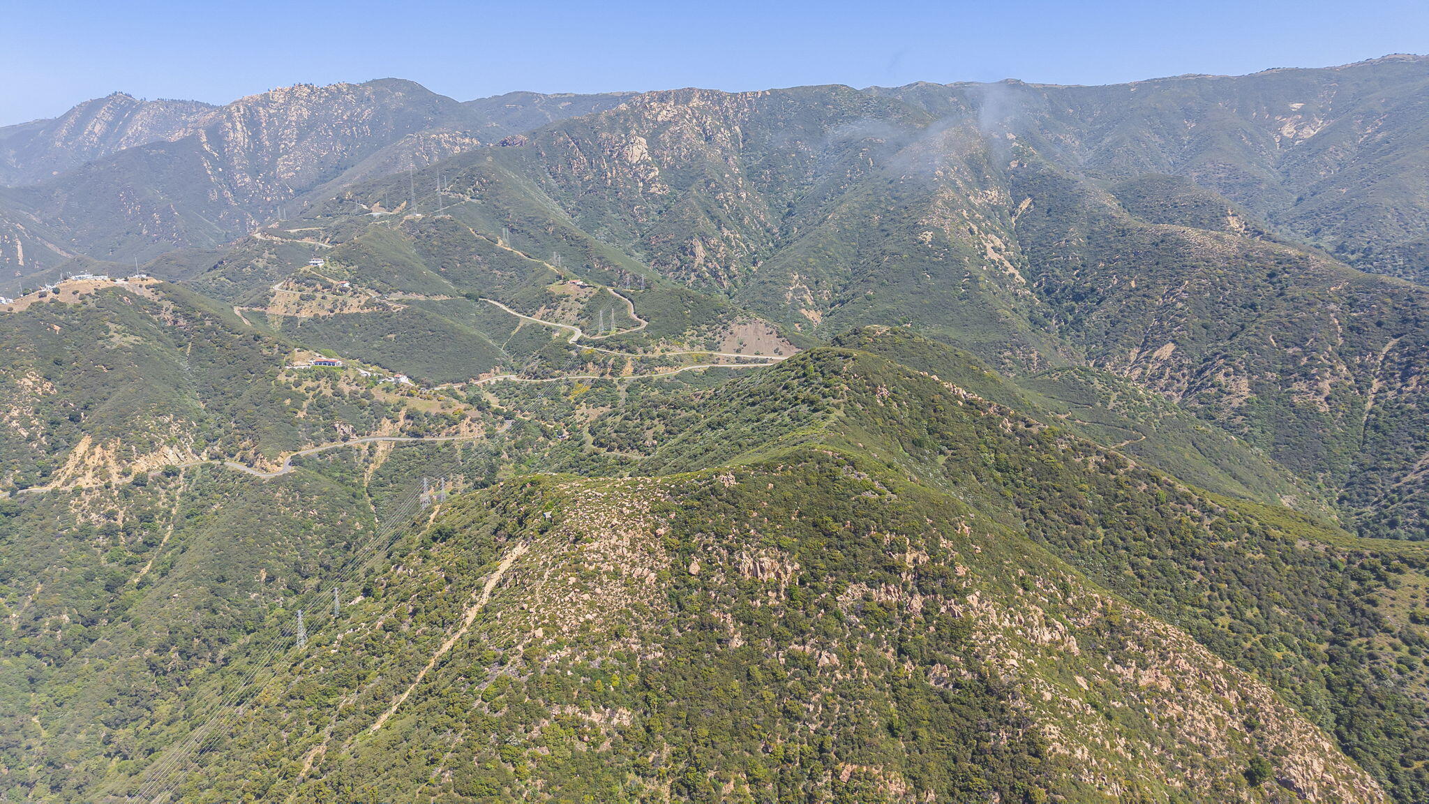 2888 Gibraltar Road Santa Barbara, CA 93105 - Photo 11 of 23 a view of a dry yard with mountains in the background