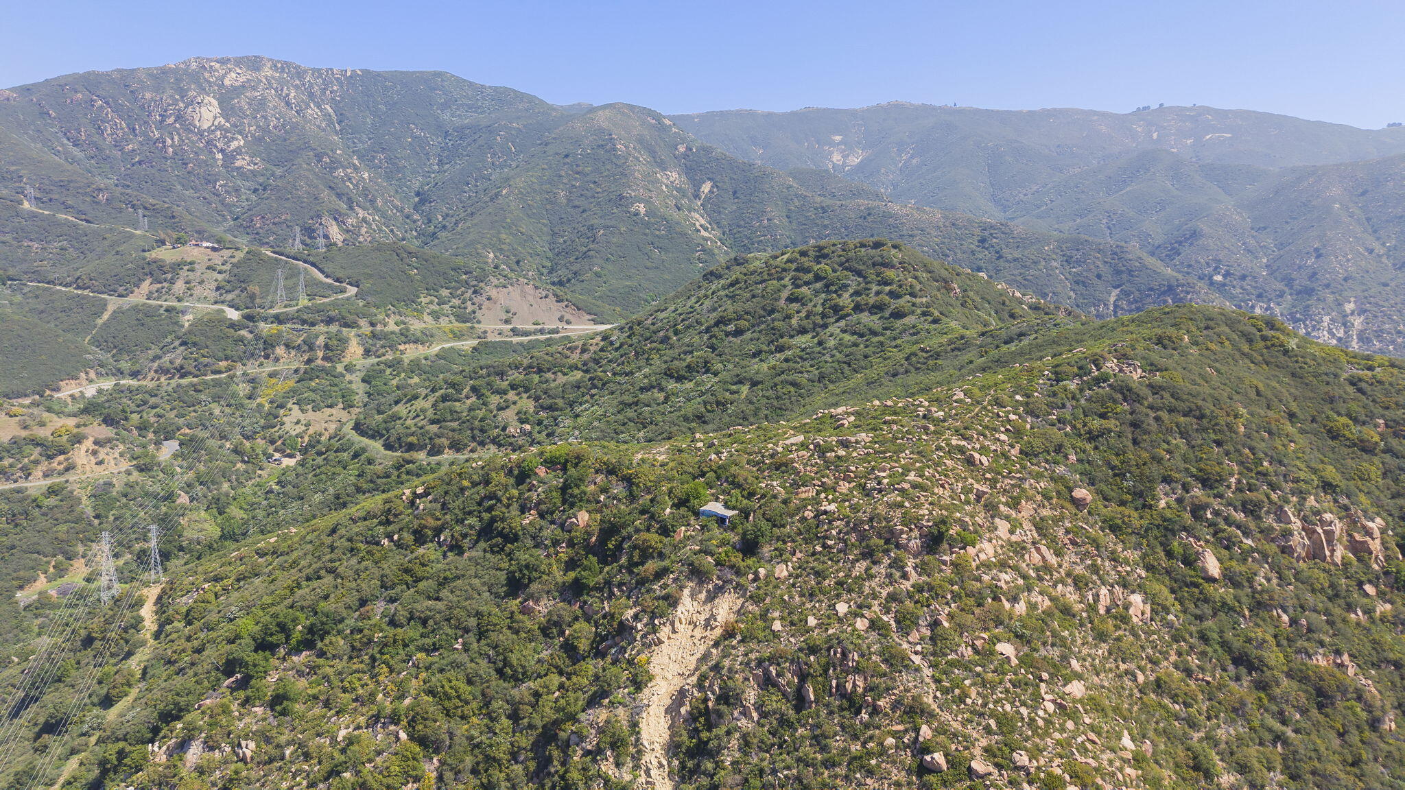 2888 Gibraltar Road Santa Barbara, CA 93105 - Photo 12 of 23 a view of a dry yard with mountains in the background