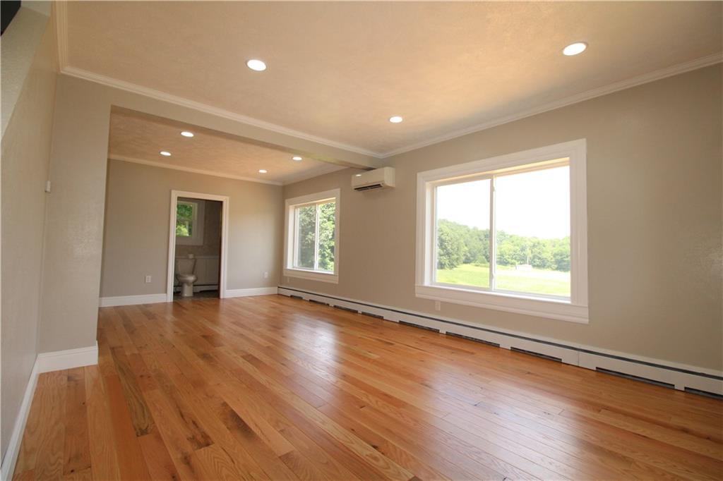 5286 Pollock Road Marion Center, PA 15759 - Photo 11 of 21 an empty room with wooden floor and windows